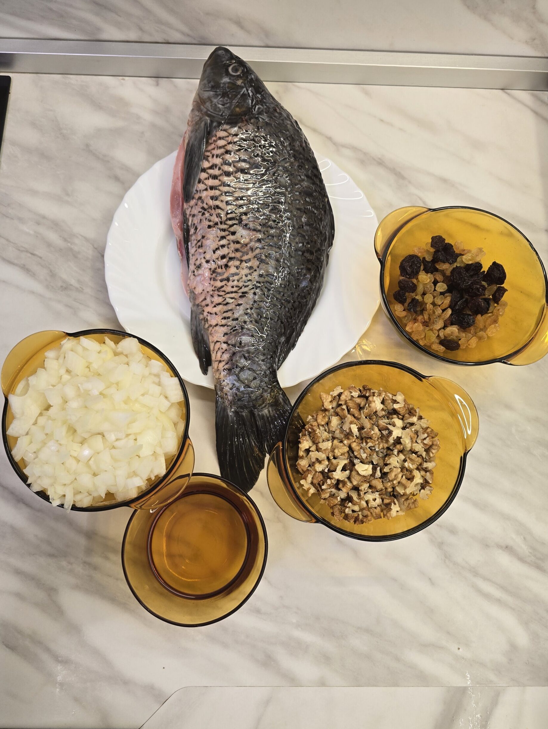 Stuffed carp with onion and walnuts