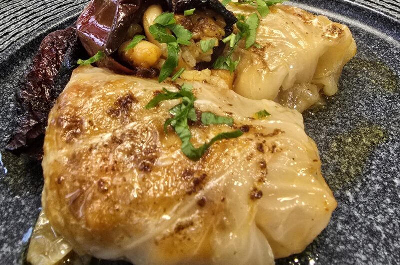 Sour cabbage and dried peppers stuffed with rice and beans