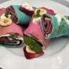 Rainbow crepe rolls with whipped cream